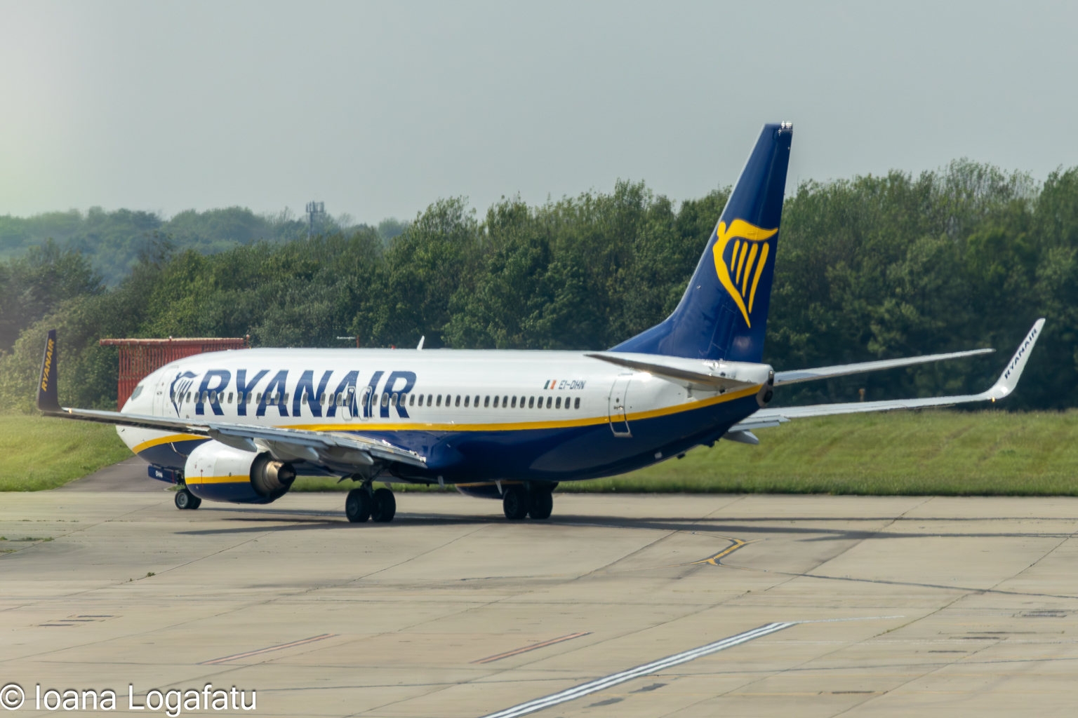 Airplane prepares for takeoff under cloudy skies